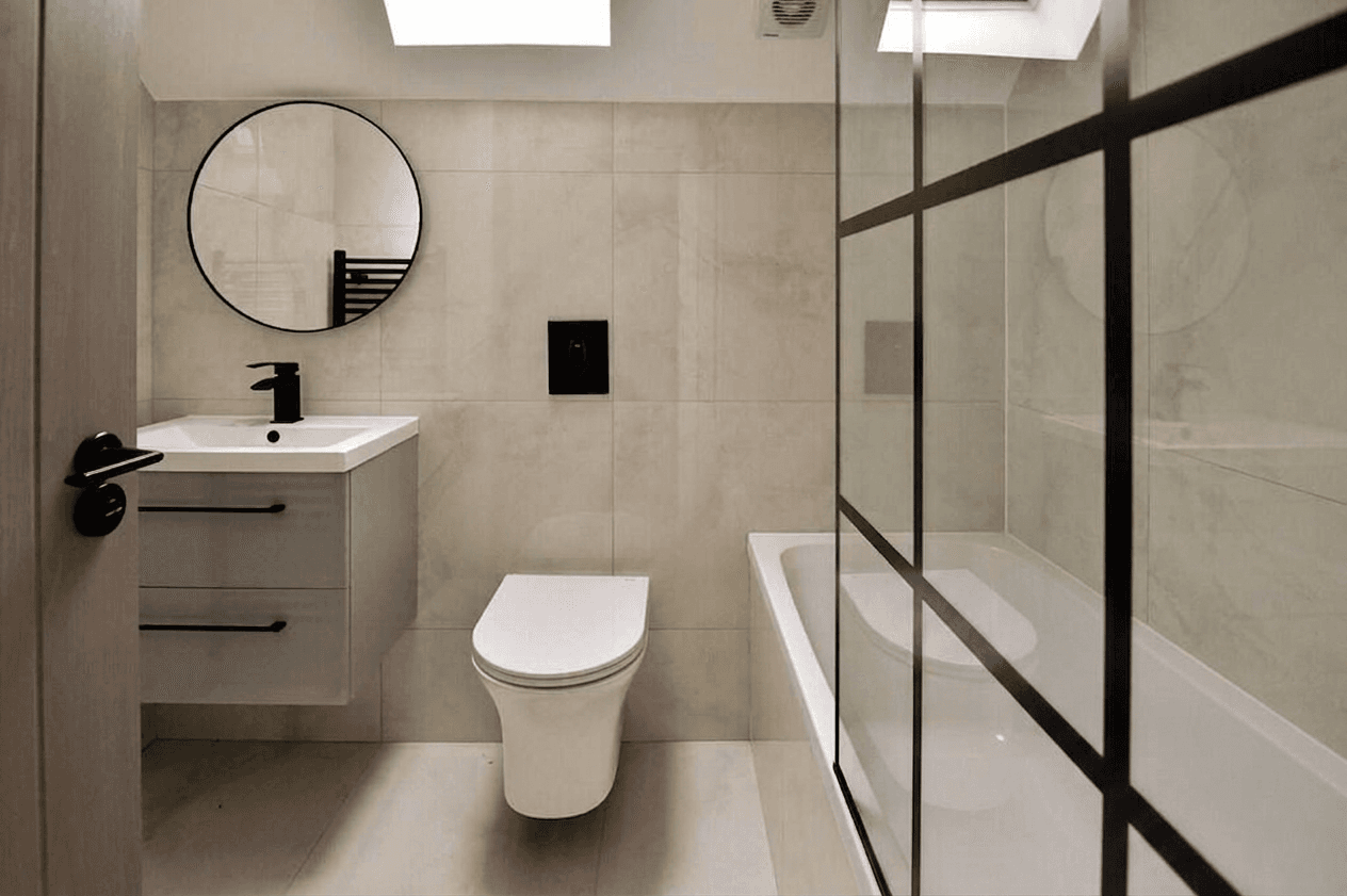 Porcelain-tiled bathroom with bath and shower screen