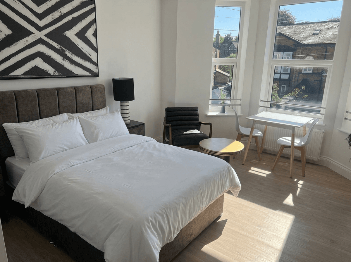 En-suite room with a bay window over the street
