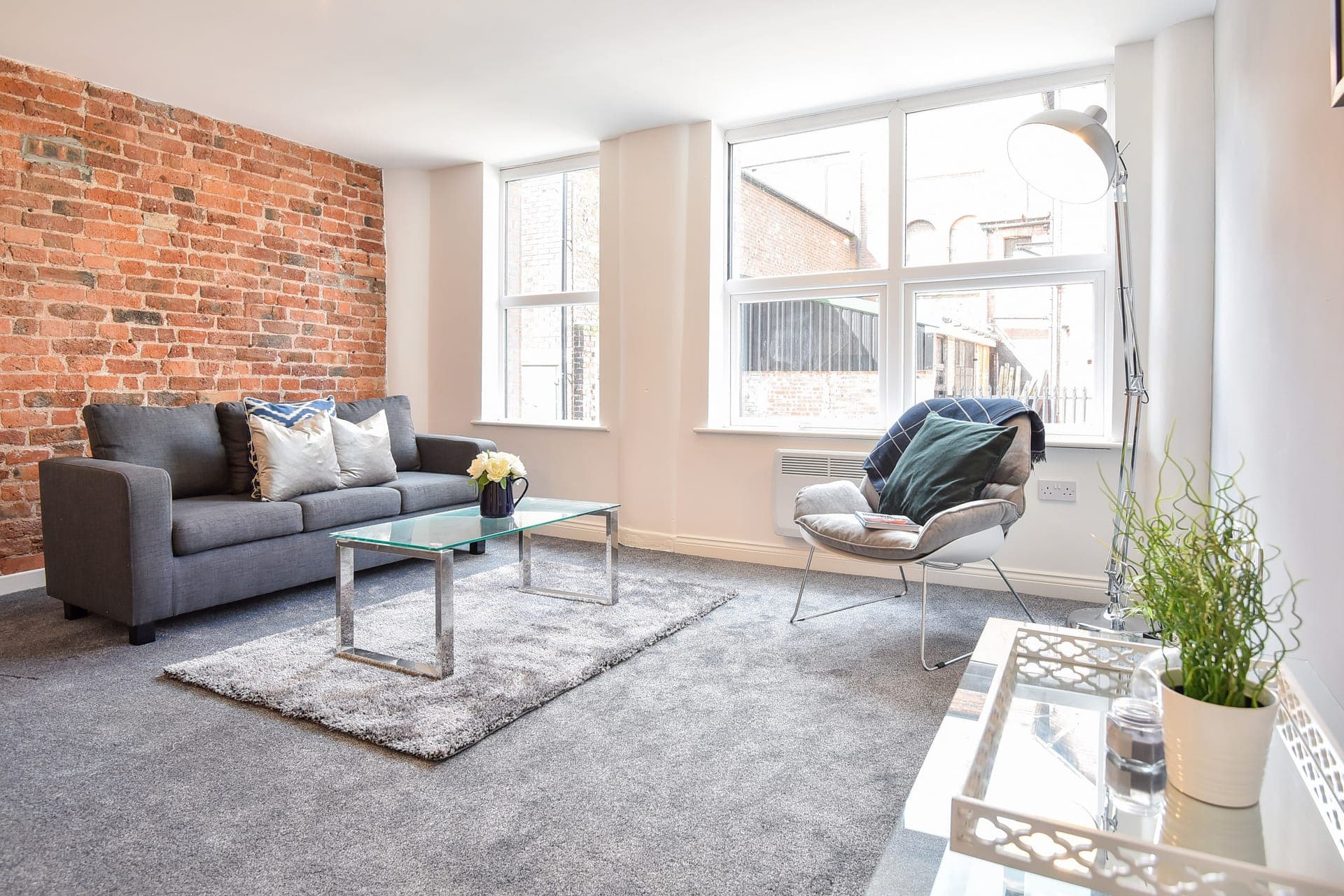 Living room against the exposed brick wall