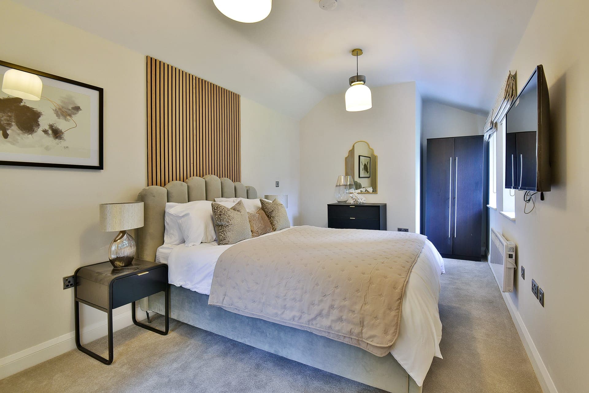 Bedroom with panelled headboard wall