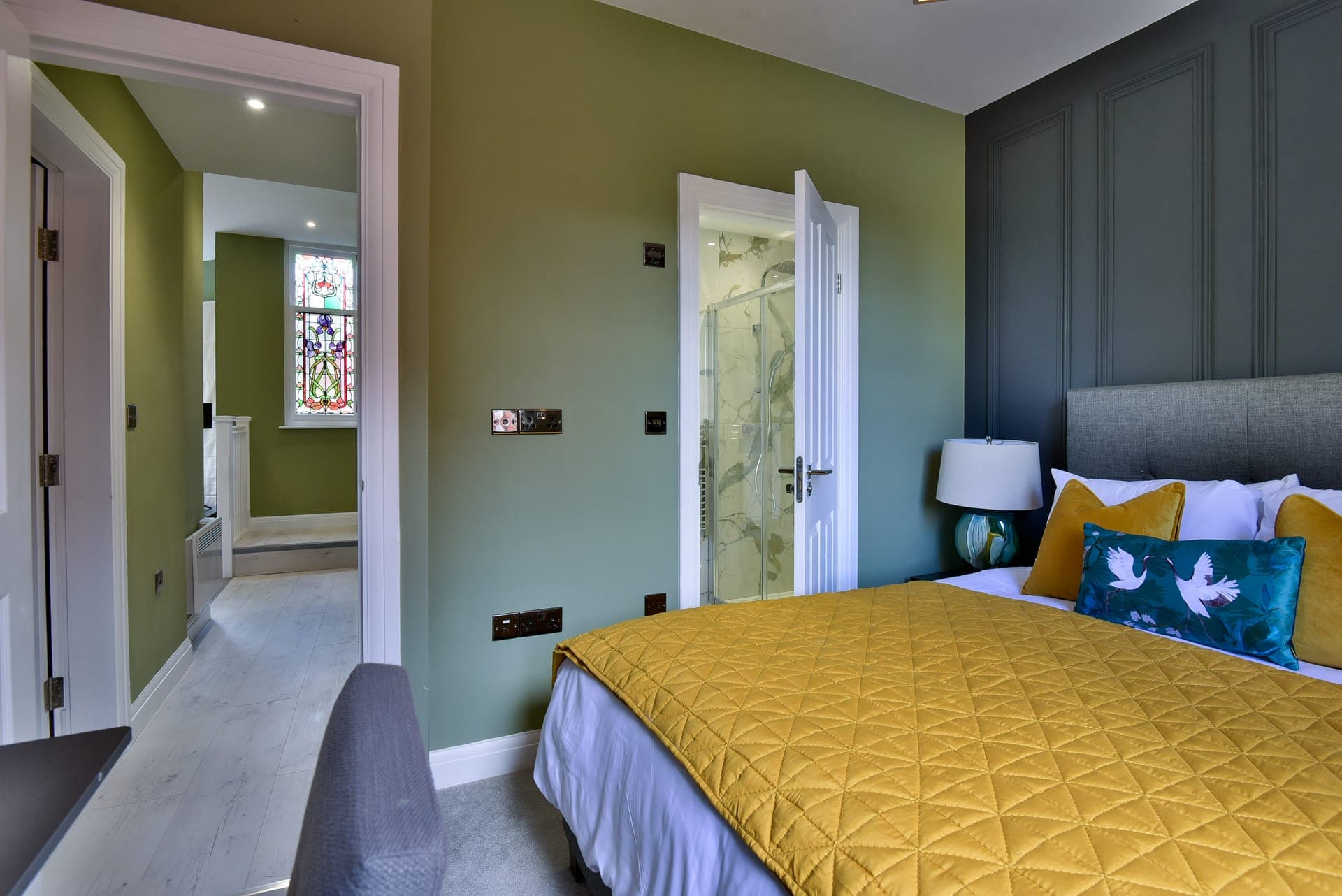 Bedroom with the stained-glass landing beyond