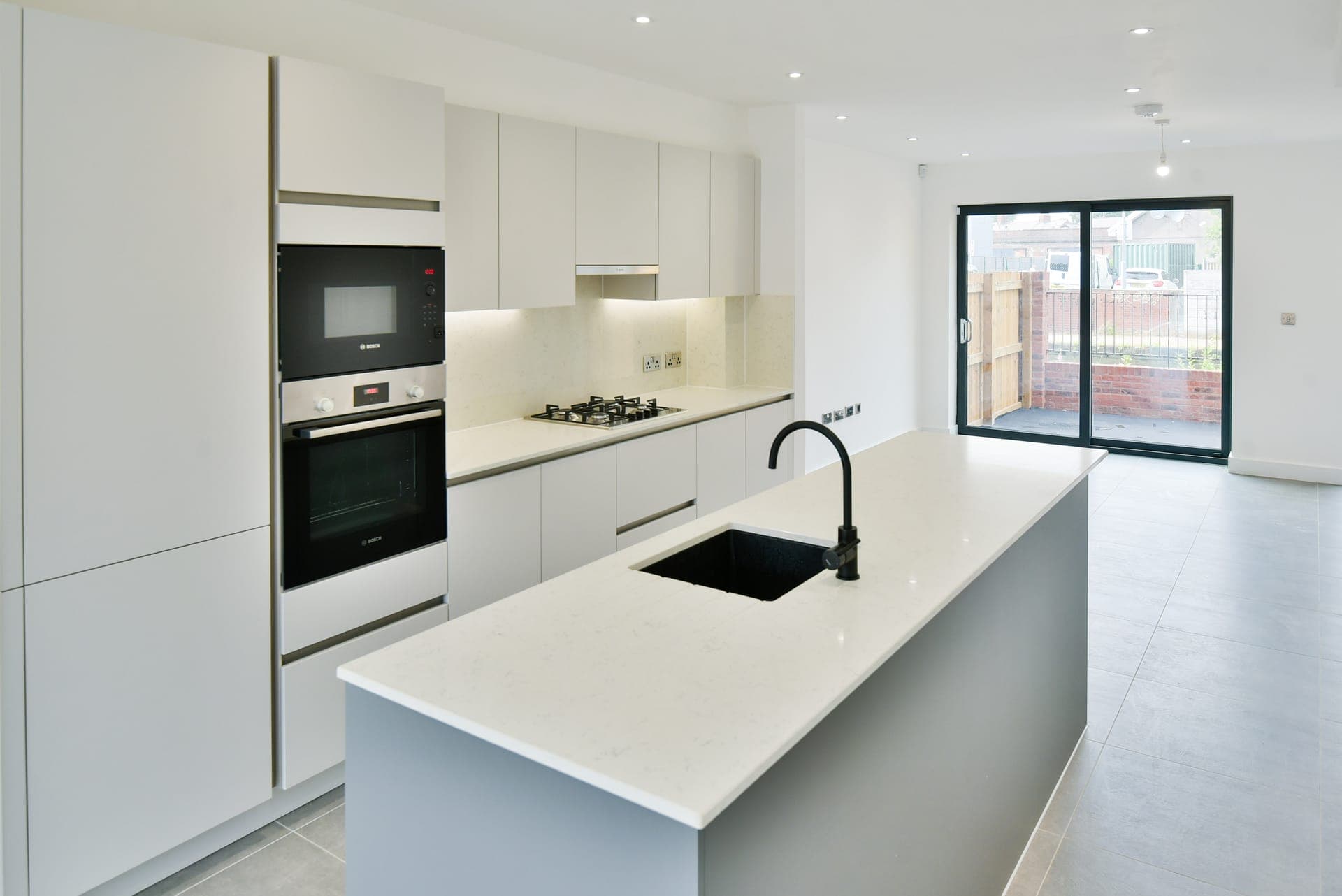 Kitchen island with patio doors beyond