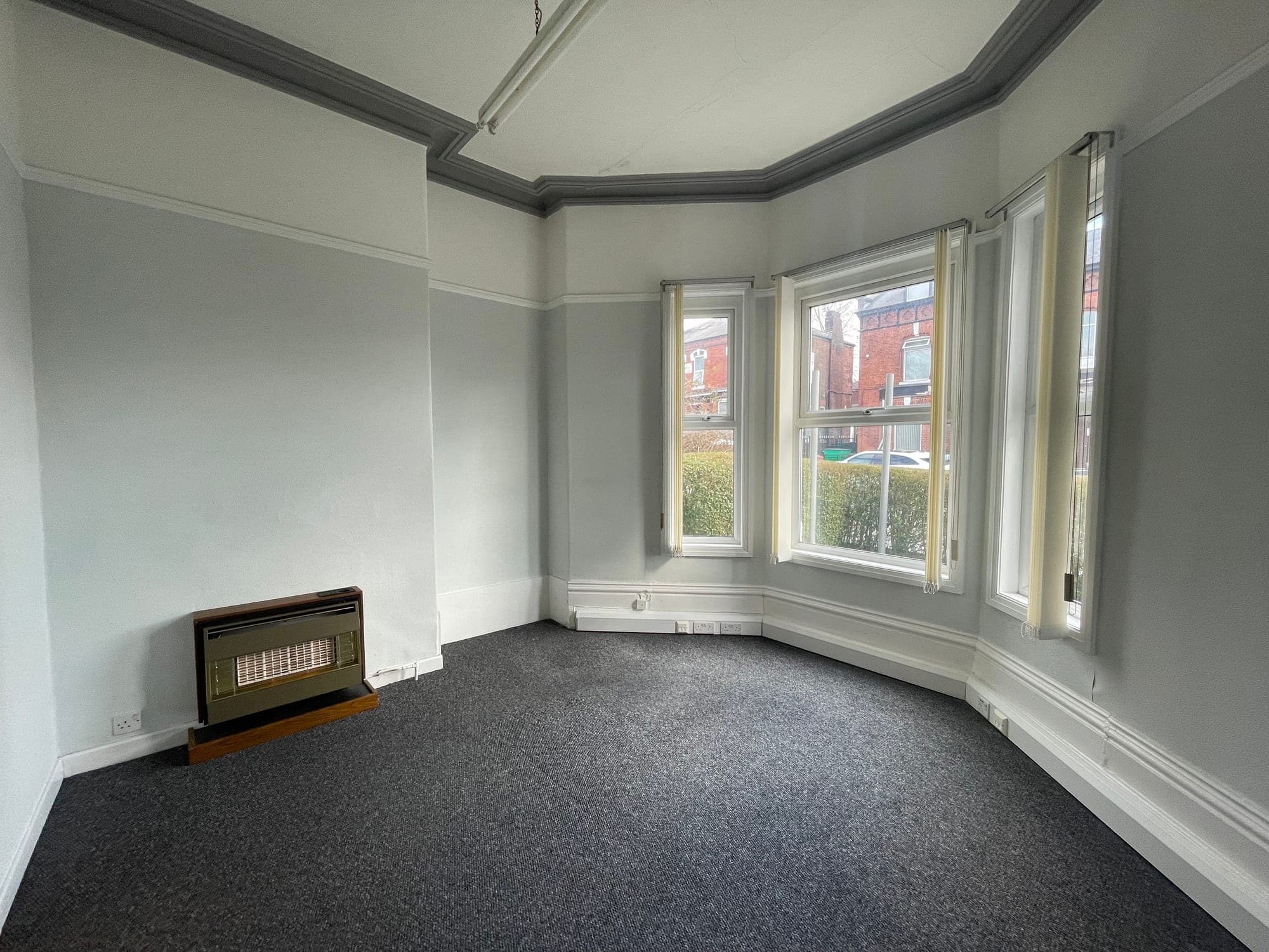 The bay-windowed front room as the building stands today