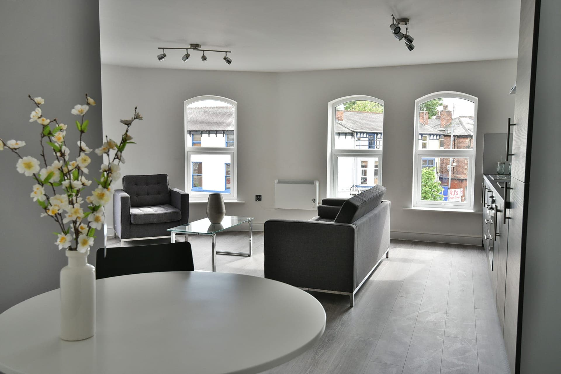 Living space lit by the original arched windows