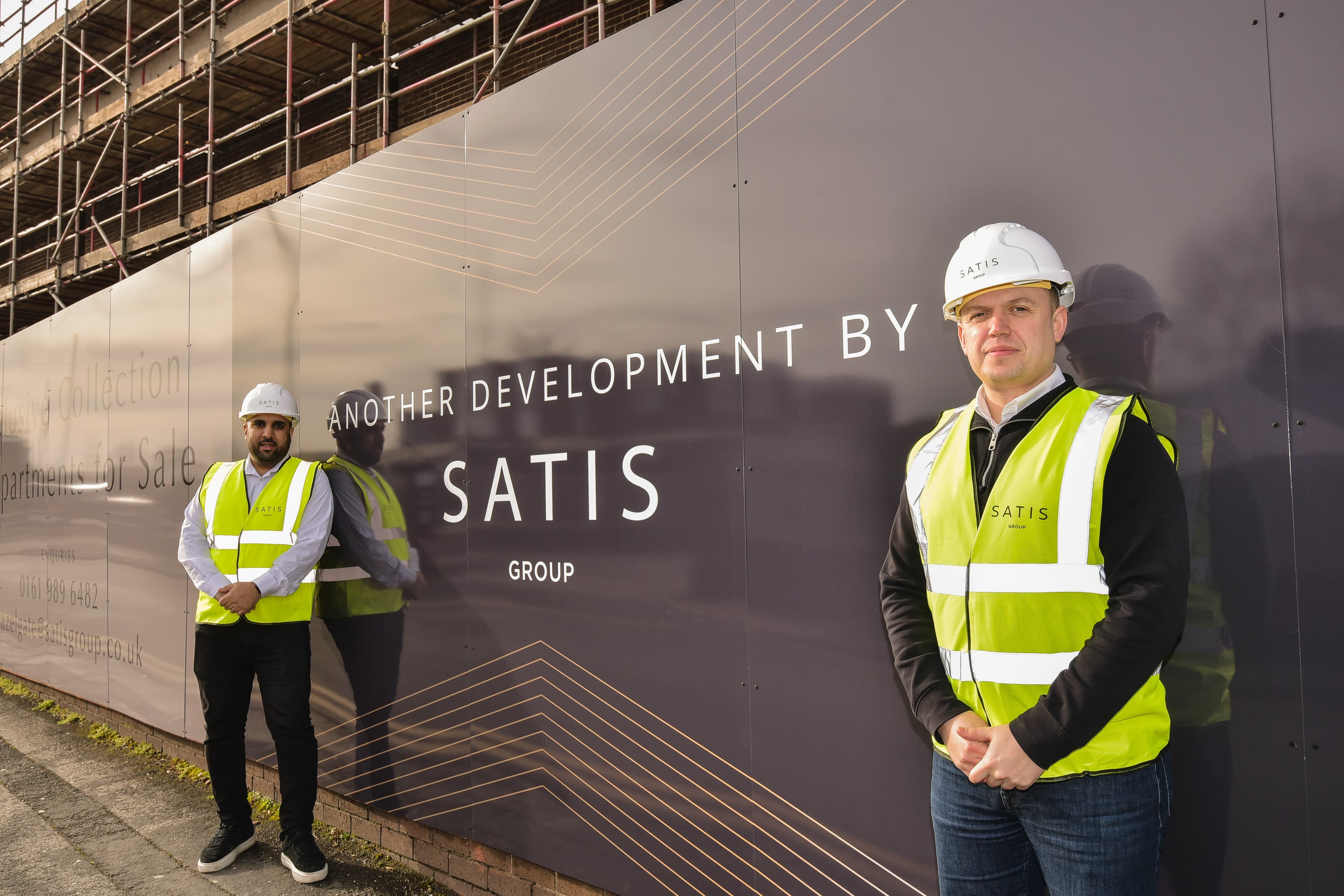 The SATIS Group team on site at a development hoarding